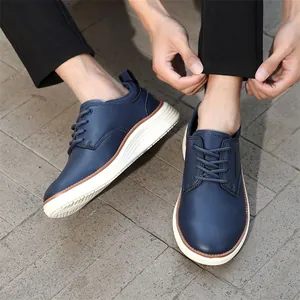 Navy blue leather casual oxford shoes with white thick sole on a male model outdoor