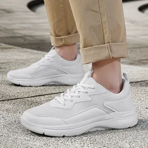 Men's breathable white mesh casual sneakers with thick shock-absorbing sole on feet