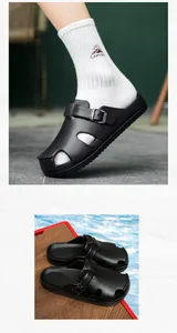 Close-up of black leather texture mule with adjustable metal buckle and non-slip sole
