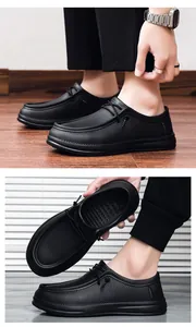 Close-up of black slip-on shoes with woven texture and non-slip rubber soles
