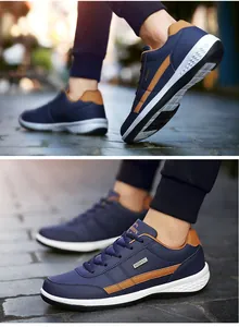 Λεπτομέρεια αδιάβροχων μπλε sneaker με καφέ δέρμα και σόλες με αντικραδασμική προστασία