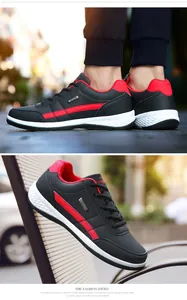 Λεπτομέρεια αδιάβροχων ανδρικών sneakers από μαύρο δέρμα με κόκκινες πινελιές