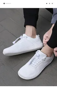 Top view of breathable white wide-toe barefoot sneakers with elastic quick-lace system