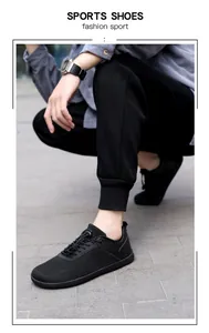 Close-up of breathable black mesh barefoot sports shoes with stylish lace-up details