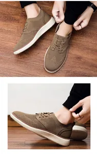 Nahaufnahme khakifarbener Mesh-Wanderschuhe mit Brogue-Muster und dicken weißen Sohlen