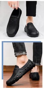 Close-up of lightweight black EVA foam loafers with breathable holes for men's casual wear