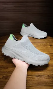 Detail of grey mesh slip-on shoe showing widened shoe last design for a comfortable fit