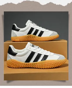 Detail of breathable mesh shoes with rubber soles and black stripes on a craft box