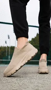 Close-up of khaki breathable mesh knit upper on men's slip-on casual sneakers