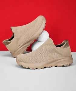 Detail of khaki knit slip-on sneakers showing breathable mesh texture and thick anti-slip sole