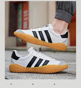 Detail of retro mesh sneakers showing high-grip gum rubber jagged outsole and suede texture