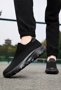 Side view of black breathable mesh slip-on sneakers with thick sole for men