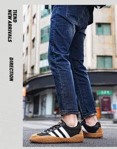 Detail view of the anti-slip rubber gum sole and mesh fabric on the casual sneaker