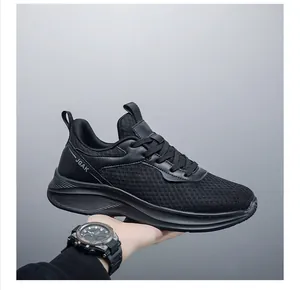 Detail view of breathable black mesh sneakers with JGAK logo and thick shock-absorbing sole