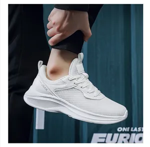 Close-up of white breathable mesh sneakers with JGAK logo and thick anti-slip sole