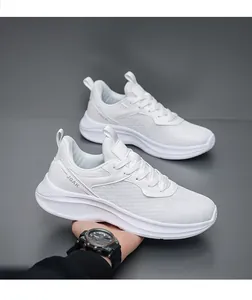 Macro view of breathable white mesh fabric and JGAK lettering on lightweight sports sneakers