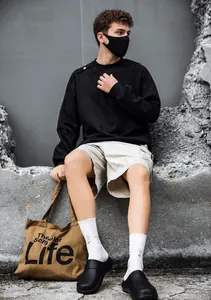 On-foot view of black waterproof non-slip chef shoes styled with streetwear apparel