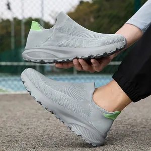 Men's breathable light grey mesh slip-on sneakers with green heel pull tab and thick sole