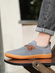 Close-up of breathable mesh men's slip-on casual shoes with anti-slip rubber outsole