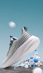Detail showing cushioned white midsole and breathable mesh fabric of running shoes