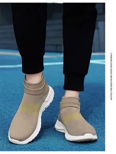 Gros plan de baskets chaussettes en maille kaki portées sur une piste de course