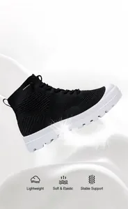 Lightweight black flyknit high-top shoes shown with a feather to highlight lightness
