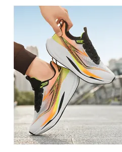 Detail of breathable mesh upper and retro trend lettering on sporty running shoes