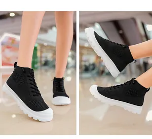 Detail of black breathable knit high-top sock sneakers with thick white anti-slip soles