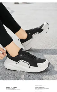 Dynamic side view of men's wide-toe sneakers with breathable mesh and thick rubber soles