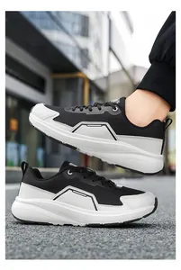 Street view detail of wide-toe mesh sneakers with breathable texture and thick sole