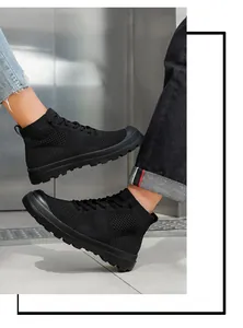Dynamic view of breathable high-top knit sneakers with thick anti-slip rubber soles in black