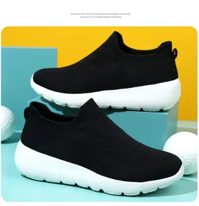 Detail of breathable black knit mesh upper and lightweight thick white EVA sole