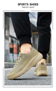 Outdoor close-up of khaki wide-fit mesh sports shoes with durable non-slip thick soles