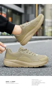 Detail shot of khaki mesh walking shoes showing fabric texture and thick rubber sole