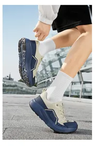 Close-up of wide-fit athletic shoes with breathable mesh and thick cushioning sole