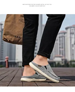 Detail of grey canvas mule loafers showing flax texture and slip-on design for men