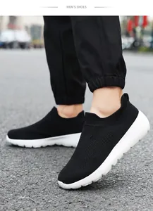 Close-up of black breathable knit mesh walking shoes on foot for outdoor wear