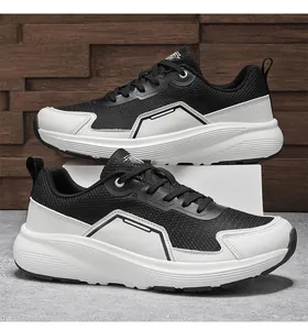 Detail of breathable mesh upper and thick cushioned sole on black and white sport shoes