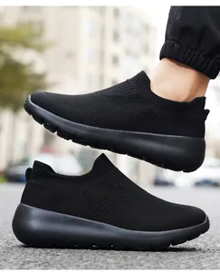Close-up of black slip-on mesh shoes with breathable knitted texture and cushioning sole