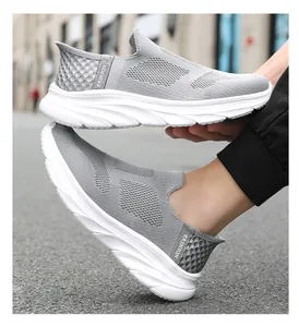 Detail of grey mesh walking shoe showing breathable fabric and cushioned white sole