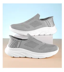 Close-up of gray knit walking shoe with slip-on design and cushioned white thick sole