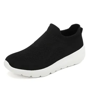 Breathable black knit slip-on sneakers for men and women with thick white rubber soles