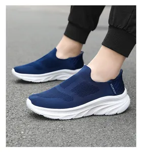 Close-up of breathable blue knit mesh fabric and flexible white wavy EVA sole on slip-on shoes