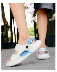 Close-up of men's white and blue outdoor beach sandals with breathable cutout design