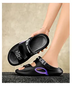 Detail view of black hiking sandals featuring purple hollow accents and adjustable buckle straps