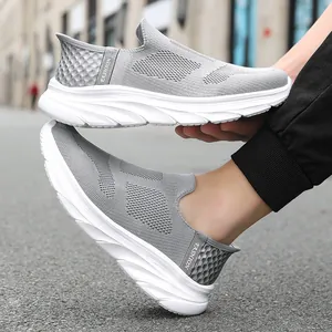Men's light grey breathable fly-knit slip-on sneakers with cushioned thick white sole