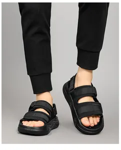 Detail view of men's black sports sandals featuring adjustable wide velcro straps and thick soles