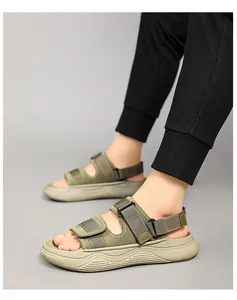 Macro side view of army green sports sandals with thick sole and velcro straps