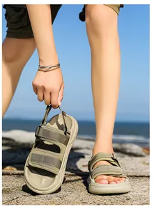 Close-up of military green outdoor sandals featuring dual velcro straps and anti-slip soles
