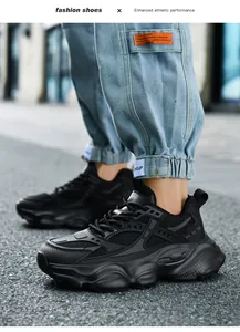 Close-up of black chunky sneakers on feet featuring breathable mesh and thick soles
